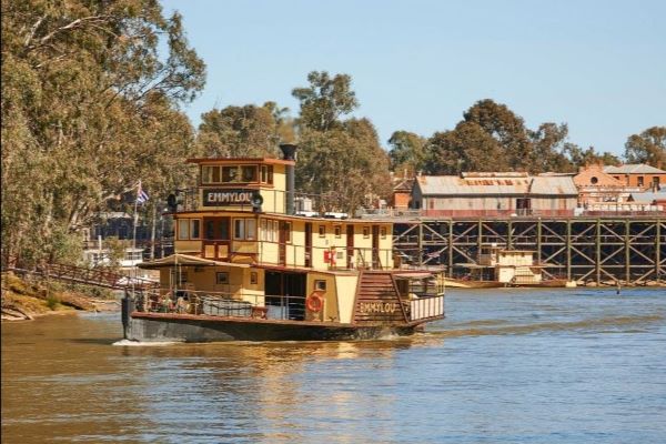 Emmylou cruising down the Murray River in front of the Wharf.